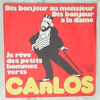 45 giri - 7'' - Carlos - Dis Bonjour Au Monsieur Dis Bonjour A La Dame / Je Rêve Des Petits Hommes Verts